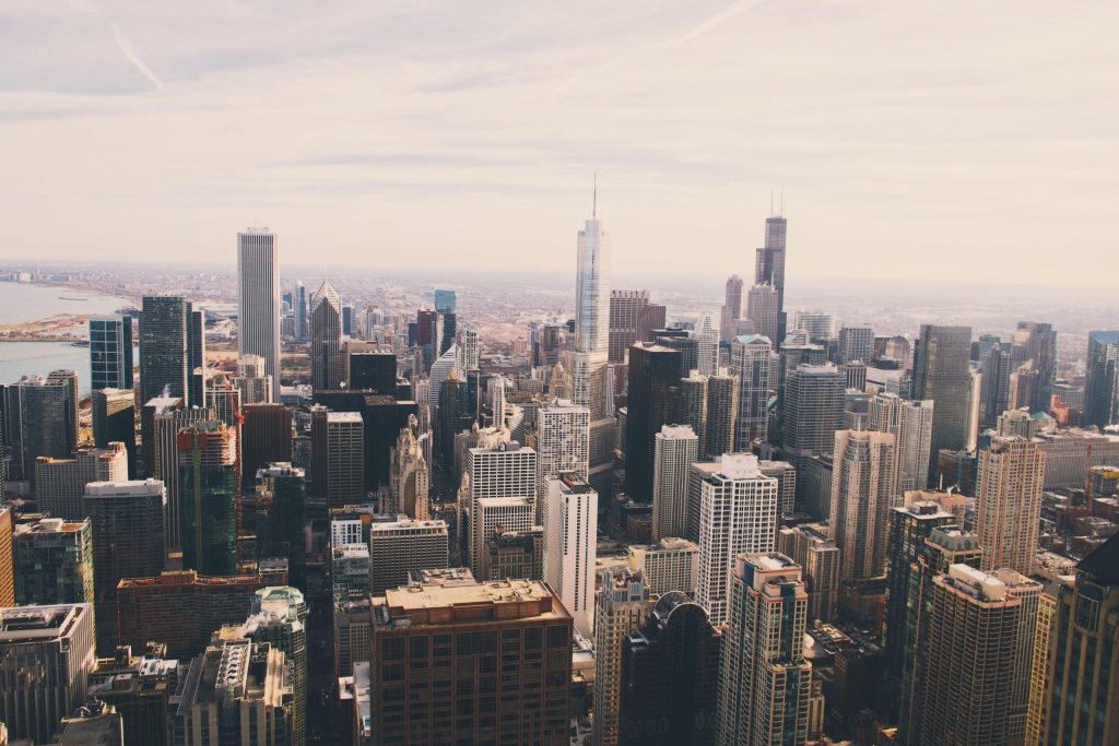 Aerial view of a dense city skyline of high-rise office and residential towers